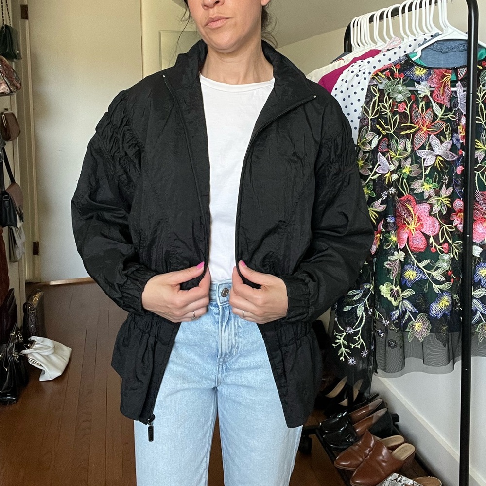 Vintage Puma Black Windbreaker with ruffle details on the shoulders & flare fit